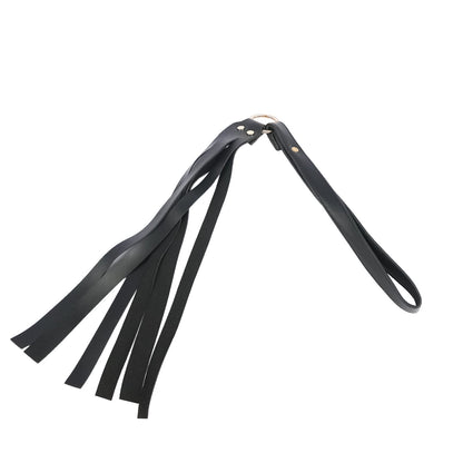 Premium black faux leather tassel flogger with wrist loop handle, soft tassels, and durable metal hardware.